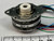 Close-up of mounting flange stamped mark, nylon hub, and STEPPER MOTOR REV. A label