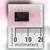 Black 8-pin DIP photocoupler printed NEC JAPAN PS2501-2 ND328, on pink packing beside millimeter rule