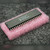 Angled view of Microchip PIC16C65A-04/P microcontroller in 40-pin plastic DIP on pink anti-static bubble wrap