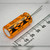 Sprague 513D 1500uF 35V electrolytic capacitor resting beside a millimeter ruler, showing markings and vent end.
