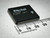 Angled view of Actel A1020B-PL84C ACT 1 FPGA, 84-pin PLCC, bright J-leads, millimeter ruler