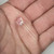10mm water clear white LED held in palm, untrimmed leads, unlit, showing dome size