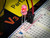 5mm red LED lit bright red on solderless breadboard, water clear lens close up