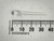 Unlit 5mm water clear LED beside PartsMine millimeter ruler, untrimmed leads visible