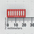 Top view of a Grayhill 76SB08S 8-position DIP rocker switch next to a millimeter ruler.