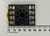 Top view of black Omron PF083A octal relay socket with eight screw terminals beside millimeter ruler