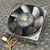 Open rotor side of 9G1224H1M037 fan showing black plastic blades and brass hub cap