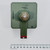 Olive-green body with stamped codes FEDERAL, 087-004, 106M3507S, and 1D visible. Central hex nut shows oxidation. Red paint remnant on lower tab.