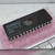 Angled view of SEEQ DQ27128-20 EPROM showing straight bright leads and quartz window