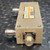 Side view of DC3001M1 showing engraved J2 OUTPUT port and N female connector.
