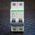 Front view of Schneider 24521 two-pole C60 breaker, D 8A 480Y/277V legend, both toggles at OFF