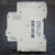 Opposite side with molded Merlin Gerin name, barcode label, and Made in France.
