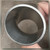 Hand holding the elbow, bore and wall thickness visible, no markings present