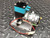 KNF FLODOS PML 1356-NF 30 diaphragm pump on aluminum mounting plate, angled view with leads