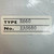 White label reading TYPE R660 and No. EA9680 photographed on a gray metal surface