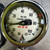 Close-up of IPS-200 dial face marked USE NO OIL, black CLOSES ON INCR arm, 30-0-100 scale