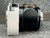 Side profile of Zeiss 47 60 10-9901 adapter, black barrel, brass threaded accessory port, red index dot