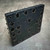 Back of B58XDX phenolic mounting base showing corner holes and light surface scratches
