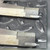 Close-up of the notched tip profiles showing the thin contact blade seated in each end face.