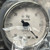 Close-up of V1535 dial, in Hg vacuum, 0 to 30 counter-clockwise scale, through factory bag