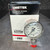 Ametek P1535 pressure gauge standing in front of its printed U.S. Gauge box