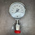 Front view of the 0 to 1000 psi dial with red flare protector below