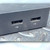 Two USB 3.0 Type-A ports visible with USB symbols beneath each; ports show dust accumulation and light surface soiling on the matte black housing.