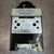 Patent label and Amerace Control Products Division marking above stamped zinc mounting bracket