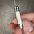 End cap face stamped LITTELFUSE MEXICO on 10A 250V ceramic cartridge fuse