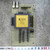 Xilinx XC3090-70 gold ceramic FPGA on green breakout PCB with DIP switches, centimeter ruler below