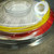 Coiled yellow 900 micron jacket with thin bare fiber emerging from the unterminated end