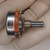 Potentiometer showing clean metal housing, clear bushing threads, intact slotted shaft, and clean solder lugs.