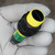 Banner photoelectric sensor showing clean lens, intact yellow cap, black housing threads, and green label with "BANNER" and "CE" marks.