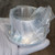 KF50 half nipple in clear plastic bag showing clean, unblemished stainless steel surface.