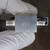 Close view of USN hand stamp on 316 stainless valve body between tube fitting ends