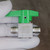 Swagelok name, flow arrow and SS-4P4T stamped on scuffed valve body, green handle.