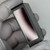 Black crinkle-finish housing with light surface scuffing; sensor window shows fine scratches across lens face, cosmetic only.
