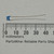 Blue epoxy body marked 221J / C0G-50; straight leads extend ~47mm; no damage to coating or leads.