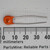 Orange disc body marked 565-1, Y400V, and 540-2; both leads straight and uncut, approximately 38mm total length per ruler.