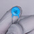 Blue disc body marked DE, UL logo, GAY, and E332M in black print; straight tinned leads; coating clean with no chips or cracks visible.