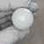 Smooth white gloss dome surface with no visible markings, scratches, or blemishes. No connector or base visible from this angle.