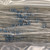 Axial-lead resistors with blue body and five-band color code: brown, black, black, gold, brown. Leads straight, no visible damage.