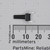 Black nylon switch stem with 4 silver-plated through-hole pins; body spans approximately 6mm on ruler. No markings visible on body.
