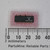 14-pin DIP black plastic body marked SN74LS132N with TI logo and code G7632. Lead pins show mild tarnish. Approximately 20mm long.