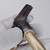 Dark oxidized head with knurled T-grip and partial stamped code visible on body; light surface patina on Gold-zinc finish shank; no visible damage.