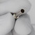 Hollow tubular barrel with smooth satin finish, small domed flange at base, open bore visible at tip, no marks or defects observed.