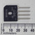 Flat black molded package, four straight leads with + and - polarity marks visible. Stamped codes: GBU8D, GT TAIWAN, 9512.