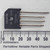 Black flat-pack body marked KBU8K, GI, TAIWAN, and date code 9306. Four leads show light oxidation along their length.