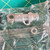 Nickel-plated brass body with knurled coupling ring and extended center insulator visible. Stamped code 2334 on barrel. Small lug tabs present.