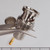 Nickel-plated body with knurled coupling nut, gold-tipped center pin visible, bayonet slots present, partial stamped text readable on collar.